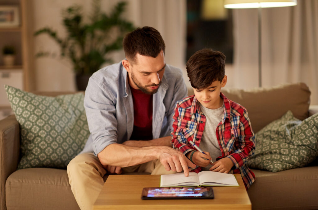 Father and son working together on homework